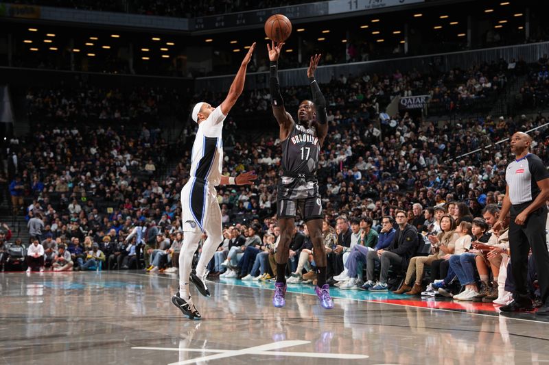 BROOKLYN, NY - DECEMBER 1: Dennis Schroder #17 of the Brooklyn Nets shoots a three point basket during the game against the Orlando Magic on December 1, 2024 at Barclays Center in Brooklyn, New York. NOTE TO USER: User expressly acknowledges and agrees that, by downloading and or using this Photograph, user is consenting to the terms and conditions of the Getty Images License Agreement. Mandatory Copyright Notice: Copyright 2024 NBAE (Photo by Jesse D. Garrabrant/NBAE via Getty Images)