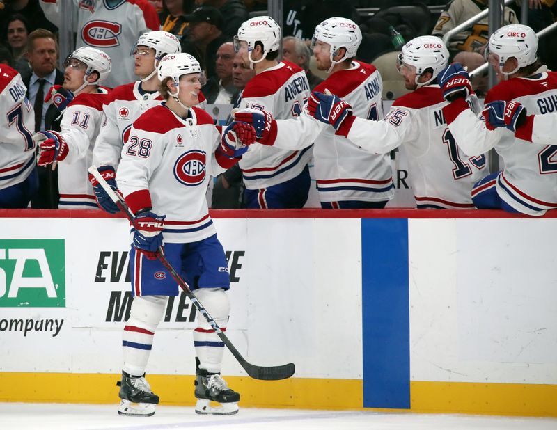 Nov 2, 2024; Pittsburgh, Pennsylvania, USA;  Montreal Canadiens center Christian Dvorak (28) celebrates with the Canadiens bench after scoring a goal against  the Pittsburgh Penguins during the third period at PPG Paints Arena. Mandatory Credit: Charles LeClaire-Imagn Images