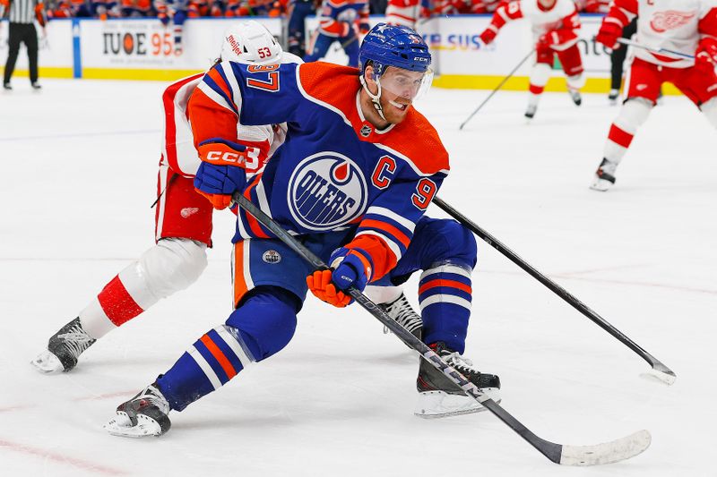 Feb 13, 2024; Edmonton, Alberta, CAN; Edmonton Oilers forward Connor McDavid (97) carries the puck around Detroit Red Wings defensemen Moritz Seider (53) during the third period at Rogers Place. Mandatory Credit: Perry Nelson-USA TODAY Sports