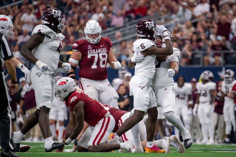 Sep 30, 2023; Arlington, Texas, USA; Texas A&M Aggies defensive lineman Enai White (6) celebrates after he sacks Arkansas Razorbacks quarterback KJ Jefferson (1) during the second half at AT&T Stadium. Mandatory Credit: Jerome Miron-USA TODAY Sports