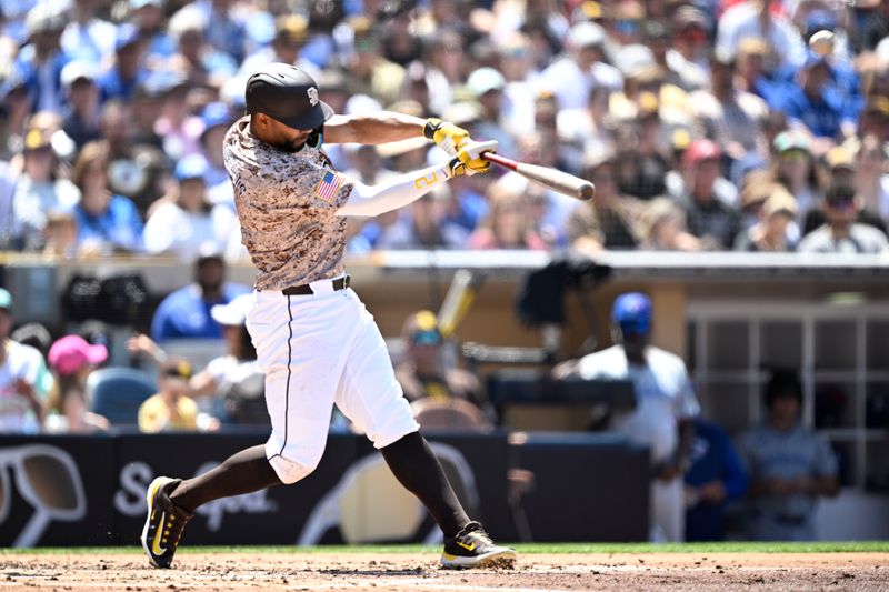 Apr 21, 2024; San Diego, California, USA; San Diego Padres second baseman Xander Bogaerts (2) hits a home run against the Toronto Blue Jays during the third inning at Petco Park. Mandatory Credit: Orlando Ramirez-USA TODAY Sports