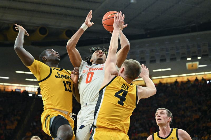 Mar 10, 2024; Iowa City, Iowa, USA; Illinois Fighting Illini guard Terrence Shannon Jr. (0) goes to the basket as Iowa Hawkeyes guard Josh Dix (4) and forward Ladji Dembele (13) defend during the first half at Carver-Hawkeye Arena. Mandatory Credit: Jeffrey Becker-USA TODAY Sports