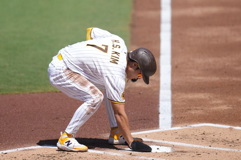 Aug 23, 2023; San Diego, California, USA;  San Diego Padres third baseman Ha-Seong Kim (7) scores on an RBI single by left fielder Juan Soto (not pictured) against the Miami Marlins during the first inning at Petco Park. Mandatory Credit: Ray Acevedo-USA TODAY Sports