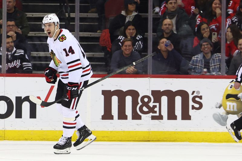 Jan 5, 2024; Newark, New Jersey, USA; Chicago Blackhawks left wing Boris Katchouk (14) celebrates his goal against the New Jersey Devils during the second period at Prudential Center. Mandatory Credit: Ed Mulholland-USA TODAY Sports