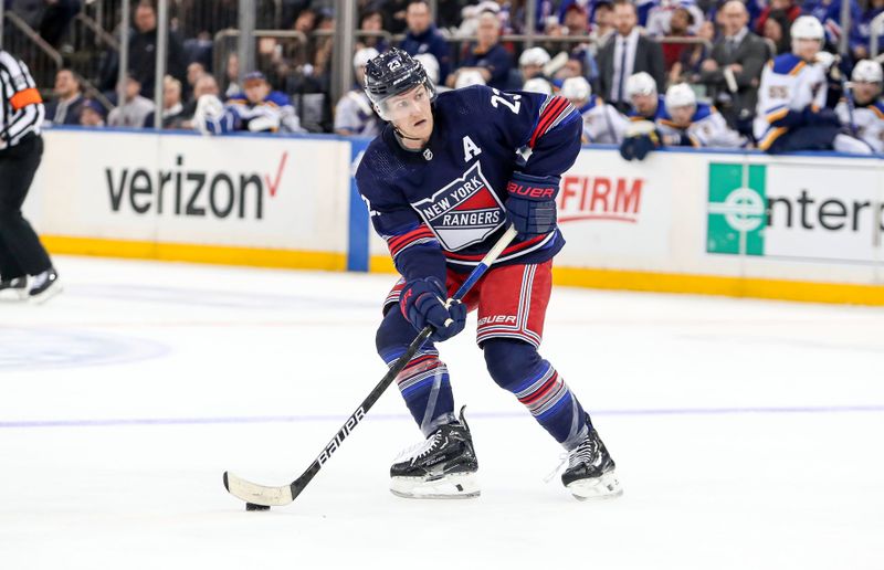 Mar 9, 2024; New York, New York, USA; New York Rangers defenseman Adam Fox (23) looks to pass against the St. Louis Blues during the second period at Madison Square Garden. Mandatory Credit: Danny Wild-USA TODAY Sports