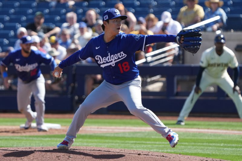 Feb 26, 2025; Phoenix, Arizona, USA; Los Angeles Dodgers pitcher Yoshinobu Yamamoto (18) throws against the Milwaukee Brewers during the first inning at American Family Fields of Phoenix. Mandatory Credit: Rick Scuteri-Imagn Images