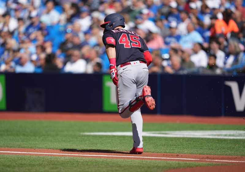 Aug 30, 2023; Toronto, Ontario, CAN; Washington Nationals first baseman Joey Meneses (45) runs to first base after hitting a single against the Toronto Blue Jays during the first inning at Rogers Centre. Mandatory Credit: Nick Turchiaro-USA TODAY Sports