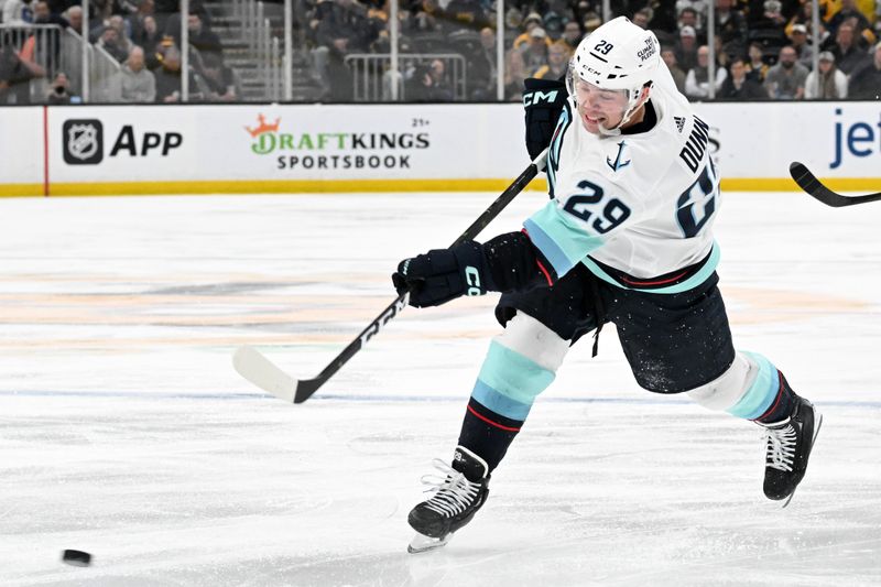 Feb 15, 2024; Boston, Massachusetts, USA; Seattle Kraken defenseman Vince Dunn (29) takes a shot against the Boston Bruins during the second period at the TD Garden. Mandatory Credit: Brian Fluharty-USA TODAY Sports