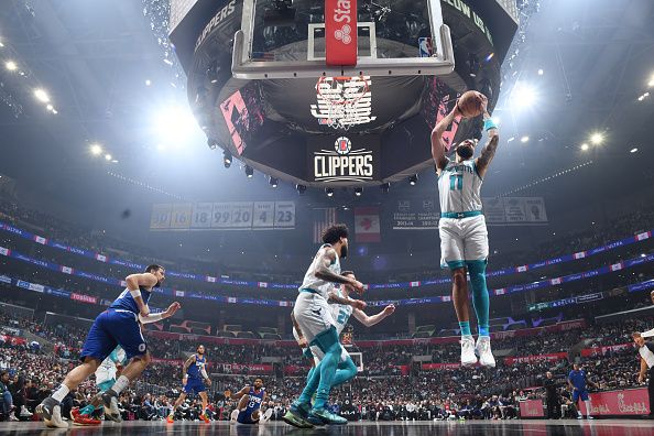 LOS ANGELES, CA - DECEMBER 26:  Cody Martin #11 of the Charlotte Hornets grabs the rebound during the game  on December 26, 2023 at Crypto.Com Arena in Los Angeles, California. NOTE TO USER: User expressly acknowledges and agrees that, by downloading and/or using this Photograph, user is consenting to the terms and conditions of the Getty Images License Agreement. Mandatory Copyright Notice: Copyright 2023 NBAE (Photo by Juan Ocampo/NBAE via Getty Images)