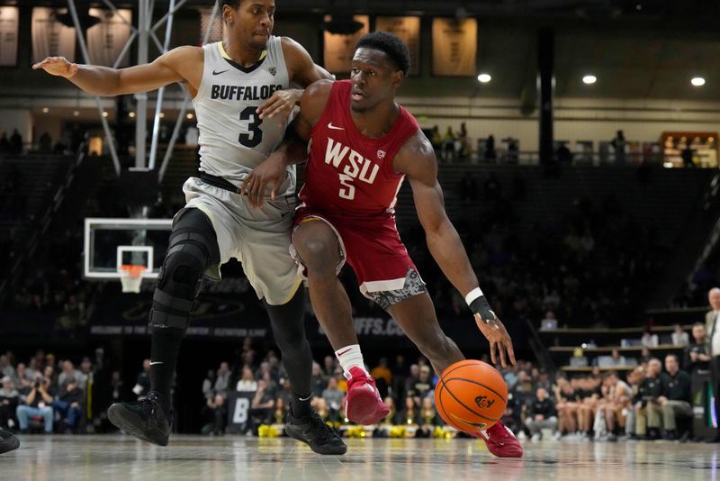 Jan 22, 2023; Boulder, Colorado, USA; Washington State Cougars guard TJ Bamba (5) drives at Colorado Buffaloes guard Jalen Gabbidon (3) in the second half at the CU Events Center. Mandatory Credit: Ron Chenoy-USA TODAY Sports