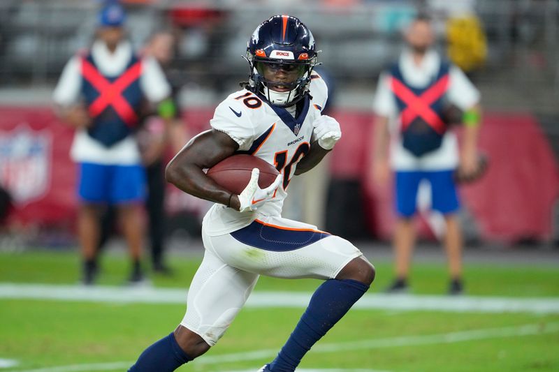 Denver Broncos wide receiver Jerry Jeudy runs toward the end zone to score against the Arizona Cardinals during the first half of an NFL preseason football game in Glendale, Ariz., Friday, Aug. 11, 2023. (AP Photo/Matt York)