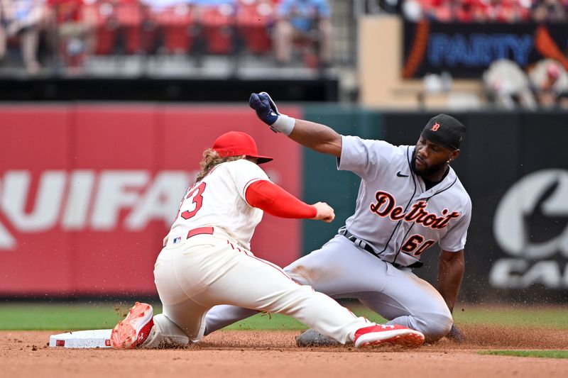 May 6, 2023; St. Louis, Missouri, USA;  Detroit Tigers left fielder Akil Baddoo (60) steals second base as St. Louis Cardinals second baseman Brendan Donovan (33) applies the tag during the fifth inning at Busch Stadium. Mandatory Credit: Jeff Curry-USA TODAY Sports