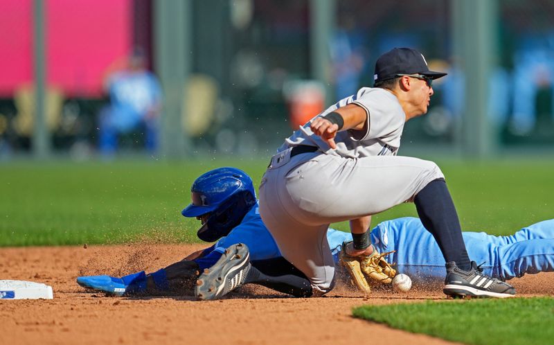 Oct 1, 2023; Kansas City, Missouri, USA; Kansas City Royals center fielder Dairon Blanco (44) steals second base as New York Yankees shortstop Anthony Volpe (11) is unable to make the catch during the sixth inning at Kauffman Stadium. Mandatory Credit: Jay Biggerstaff-USA TODAY Sports