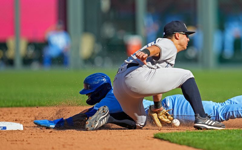 Oct 1, 2023; Kansas City, Missouri, USA; Kansas City Royals center fielder Dairon Blanco (44) steals second base as New York Yankees shortstop Anthony Volpe (11) is unable to make the catch during the sixth inning at Kauffman Stadium. Mandatory Credit: Jay Biggerstaff-USA TODAY Sports