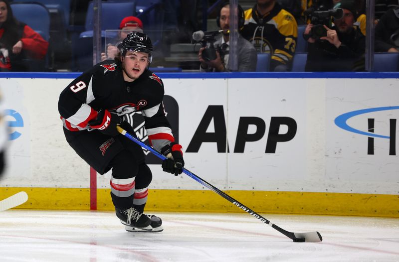 Dec 27, 2023; Buffalo, New York, USA;  Buffalo Sabres left wing Zach Benson (9) looks to make a pass during the first period against the Boston Bruins at KeyBank Center. Mandatory Credit: Timothy T. Ludwig-USA TODAY Sports