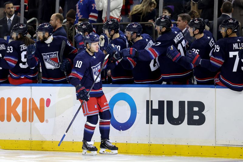 Jan 14, 2024; New York, New York, USA; New York Rangers left wing Artemi Panarin (10) celebrates his goal against the Washington Capitals with teammates during the first period at Madison Square Garden. Mandatory Credit: Brad Penner-USA TODAY Sports