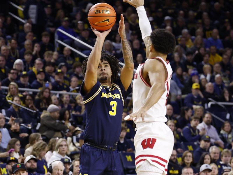 Jan 10, 2026; Ann Arbor, Michigan, USA;  Michigan Wolverines guard Elliot Cadeau (3) shoots in the first half against the Wisconsin Badgers at Crisler Center. Mandatory Credit: Rick Osentoski-Imagn Images