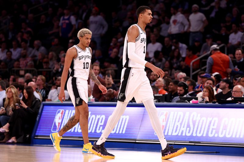 NEW YORK, NEW YORK - NOVEMBER 08: Victor Wembanyama #1 of the San Antonio Spurs walks on the court with teammate Jeremy Sochan #10 against the New York Knicks during the second quarter in the game at Madison Square Garden on November 08, 2023 in New York City. NOTE TO USER: User expressly acknowledges and agrees that, by downloading and or using this photograph, User is consenting to the terms and conditions of the Getty Images License Agreement. (Photo by Elsa/Getty Images)