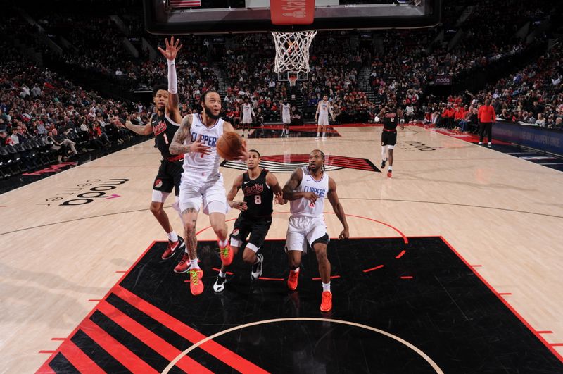 PORTLAND, OR - MARCH 20: Amir Coffey #7 of the LA Clippers drives to the basket during the game against the Portland Trail Blazers on March 20, 2024 at the Moda Center Arena in Portland, Oregon. NOTE TO USER: User expressly acknowledges and agrees that, by downloading and or using this photograph, user is consenting to the terms and conditions of the Getty Images License Agreement. Mandatory Copyright Notice: Copyright 2024 NBAE (Photo by Cameron Browne/NBAE via Getty Images)