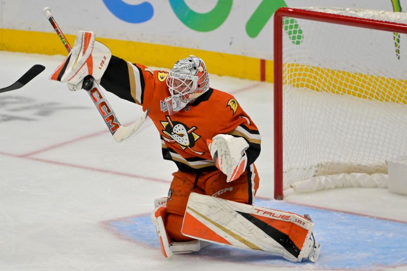 Nov 5, 2024; Anaheim, California, USA; Anaheim Ducks goaltender Lukas Dostal (1) makes a save off a shot by Vancouver Canucks center Elias Pettersson (40) in the second period at Honda Center. Mandatory Credit: Jayne Kamin-Oncea-Imagn Images