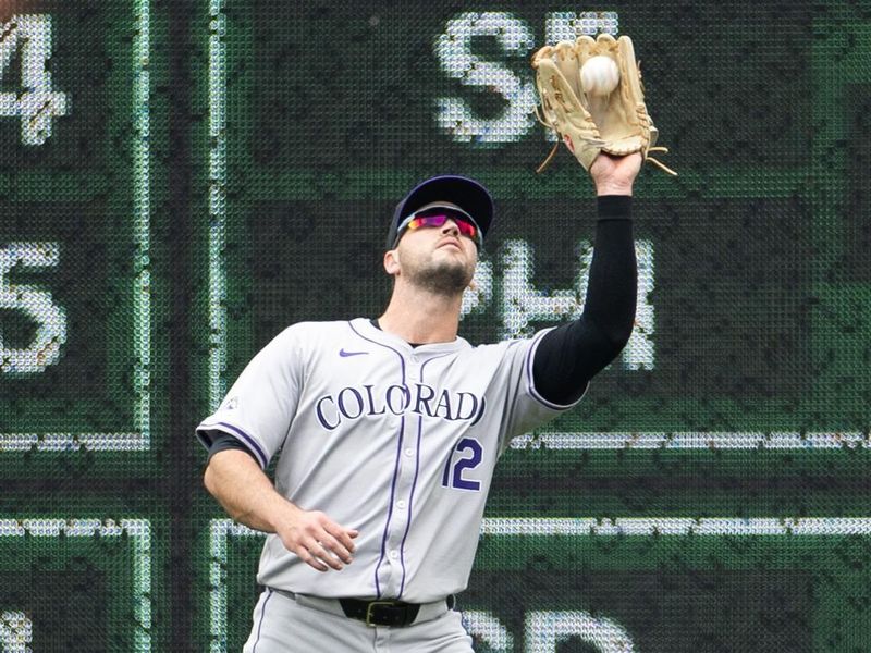 May 5, 2024; Pittsburgh, Pennsylvania, USA; Colorado Rockies right fielder Sean Bouchard (12) makes a catch for the first out against the Pittsburgh Pirates during the first inning at PNC Park. Mandatory Credit: Scott Galvin-USA TODAY Sports