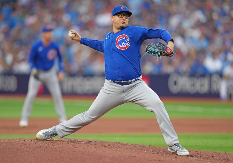 Aug 11, 2023; Toronto, Ontario, CAN; Chicago Cubs starting pitcher Javier Assad (72) throws a pitch against the Toronto Blue Jays during the first inning at Rogers Centre. Mandatory Credit: Nick Turchiaro-USA TODAY Sports