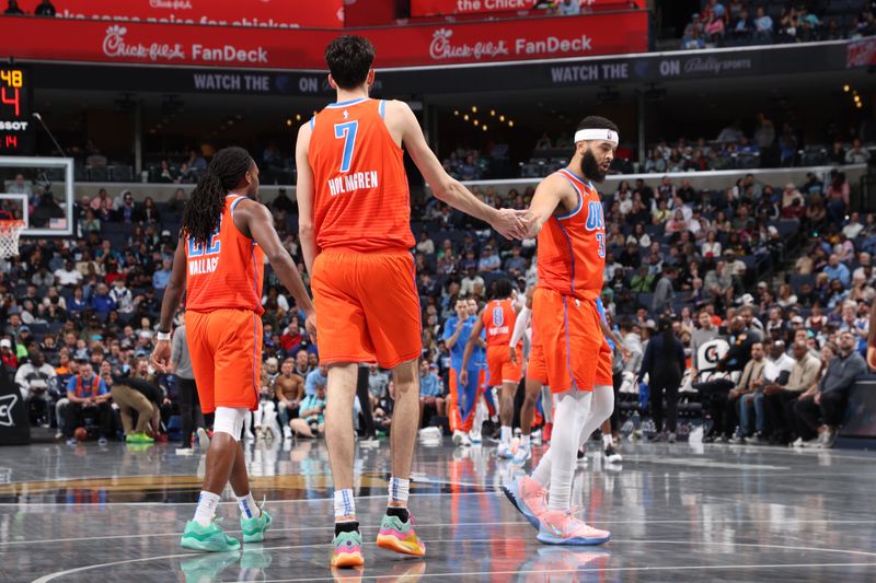 MEMPHIS, TN - MARCH 16:  Chet Holmgren #7 high fives  Kenrich Williams #34 of the Oklahoma City Thunder during the game against the Memphis Grizzlies on March 16, 2024 at FedExForum in Memphis, Tennessee. NOTE TO USER: User expressly acknowledges and agrees that, by downloading and or using this photograph, User is consenting to the terms and conditions of the Getty Images License Agreement. Mandatory Copyright Notice: Copyright 2024 NBAE (Photo by Joe Murphy/NBAE via Getty Images)