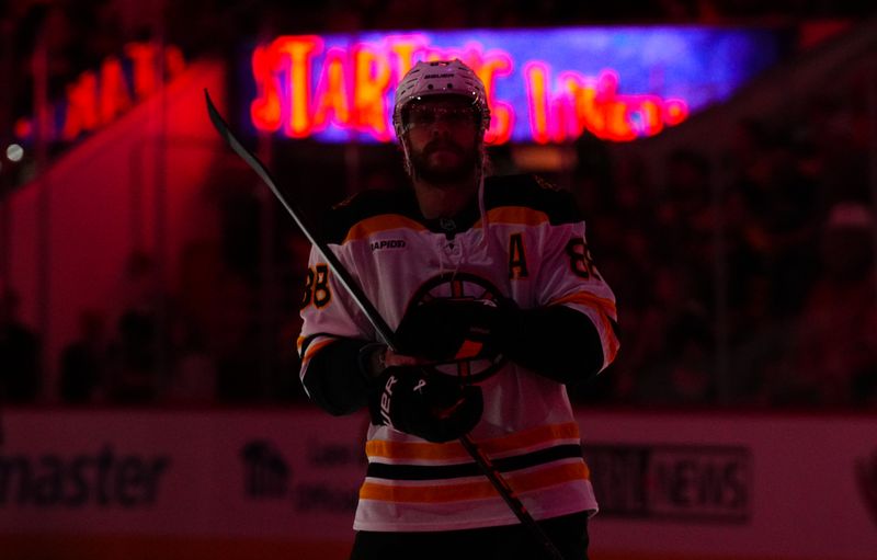 Oct 31, 2024; Raleigh, North Carolina, USA;  Boston Bruins right wing David Pastrnak (88) looks on before the start of the game against the Carolina Hurricanes at Lenovo Center. Mandatory Credit: James Guillory-Imagn Images