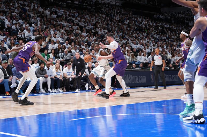 MINNEAPOLIS, MN -  APRIL 20: Anthony Edwards #5 of the Minnesota Timberwolves handles the ball during Round One Game One of the 2024 NBA Playoffs against the Phoenix Suns on April 20, 2024 at Target Center in Minneapolis, Minnesota. NOTE TO USER: User expressly acknowledges and agrees that, by downloading and or using this Photograph, user is consenting to the terms and conditions of the Getty Images License Agreement. Mandatory Copyright Notice: Copyright 2024 NBAE (Photo by Jordan Johnson/NBAE via Getty Images)