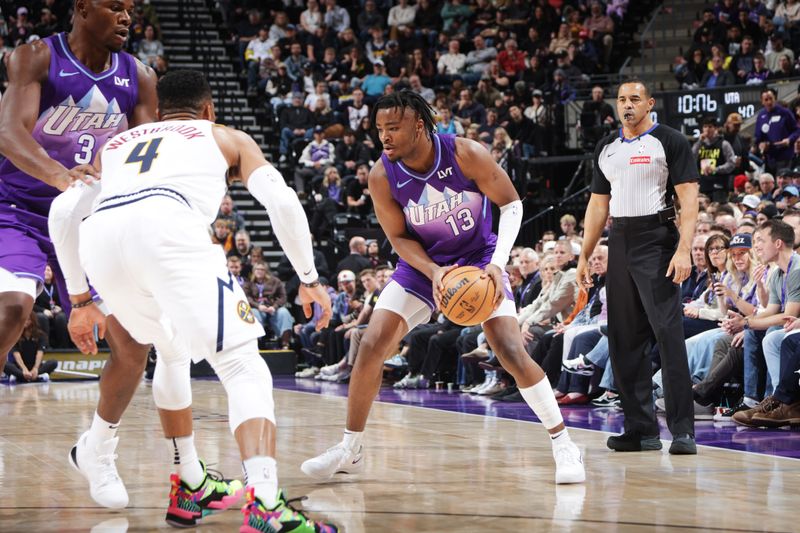 SALT LAKE CITY, UT - WEDNESDAY 27: Isaiah Collier #13 of the Utah Jazz dribbles the ball during the game against the Denver Nuggets on Wednesday 27, 2024 at vivint.SmartHome Arena in Salt Lake City, Utah. NOTE TO USER: User expressly acknowledges and agrees that, by downloading and or using this Photograph, User is consenting to the terms and conditions of the Getty Images License Agreement. Mandatory Copyright Notice: Copyright 2024 NBAE (Photo by Melissa Majchrzak/NBAE via Getty Images)