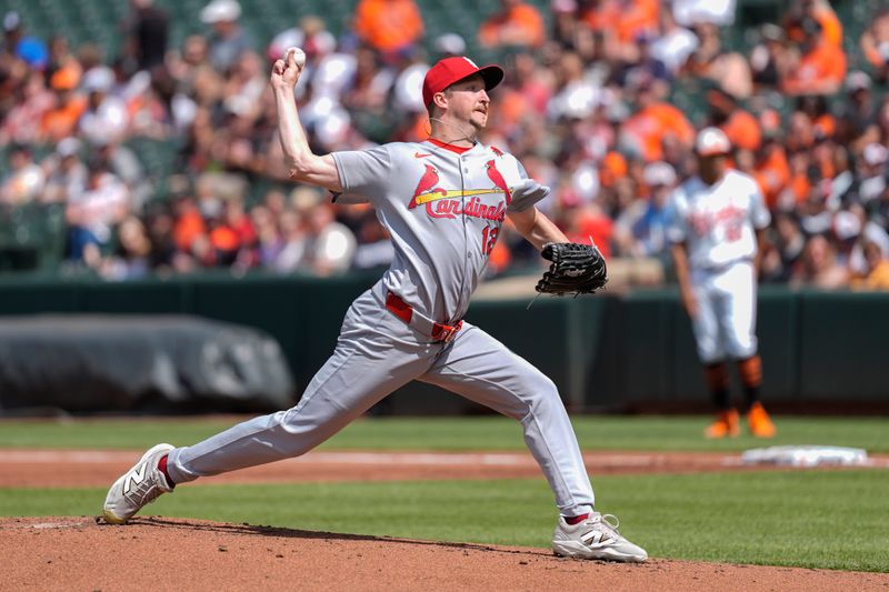 May 26, 2025; Baltimore, Maryland, USA; St. Louis Cardinals pitcher Erick Fedde (12) delivers a pitch against the Baltimore Orioles during the first inning at Oriole Park at Camden Yards. Mandatory Credit: Gregory Fisher-Imagn Images