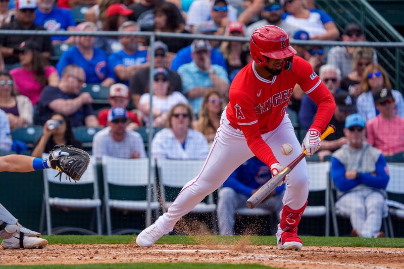 Mar 16, 2024; Tempe, Arizona, USA; Los Angeles Angels infielder Arol Vera (62) bunts in the eighth during a spring training game against the Chicago Cubs at Tempe Diablo Stadium. Mandatory Credit: Allan Henry-USA TODAY Sports