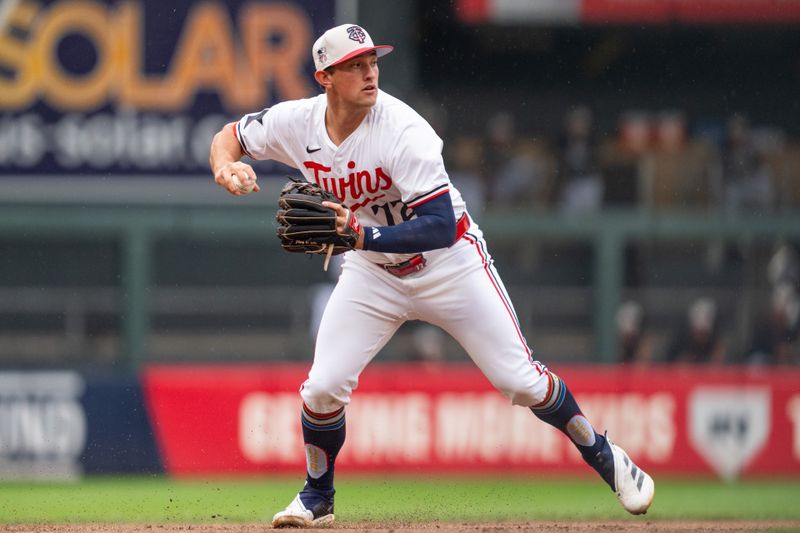 Jul 4, 2024; Minneapolis, Minnesota, USA; Minnesota Twins third baseman Brooks Lee (72) throws to first to retire the Detroit Tigers in the second inning at Target Field. Mandatory Credit: Matt Blewett-USA TODAY Sports