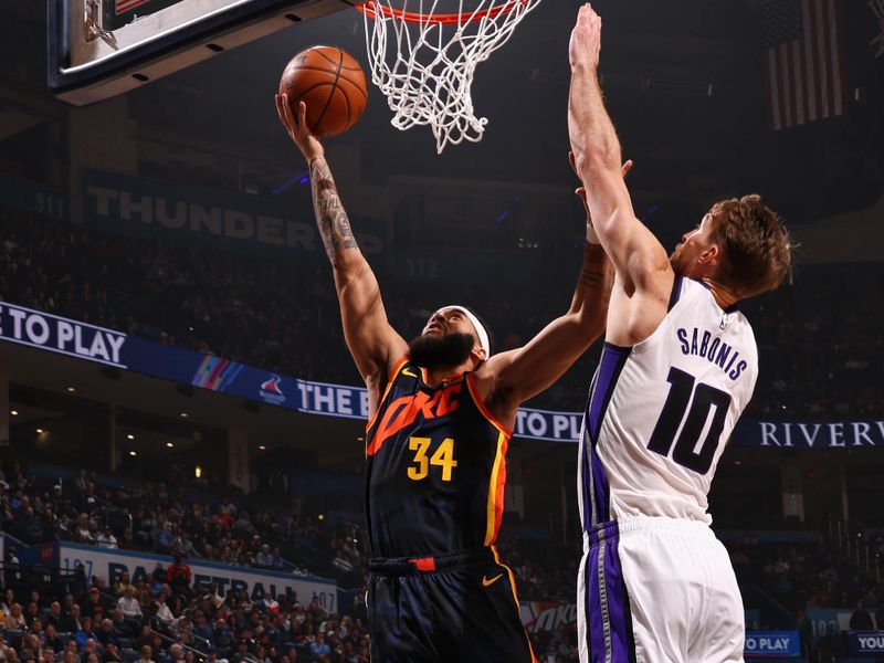 OKLAHOMA CITY, OK - FEBRUARY 11: Kenrich Williams #34 of the Oklahoma City Thunder drives to the basket during the game against the Sacramento Kings on February 11, 2024 at Paycom Arena in Oklahoma City, Oklahoma. NOTE TO USER: User expressly acknowledges and agrees that, by downloading and or using this photograph, User is consenting to the terms and conditions of the Getty Images License Agreement. Mandatory Copyright Notice: Copyright 2024 NBAE (Photo by Zach Beeker/NBAE via Getty Images)