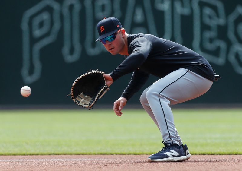 Apr 9, 2024; Pittsburgh, Pennsylvania, USA;  Detroit Tigers first baseman Spencer Torkelson (20) takes ground balls before a game against the Pittsburgh Pirates at PNC Park. Mandatory Credit: Charles LeClaire-USA TODAY Sports