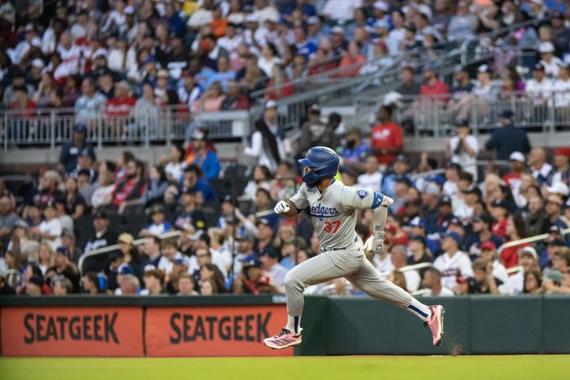 Sep 14, 2024; Cumberland, Georgia, USA; Los Angeles Dodgers outfielder Teoscar Hernández (37) runs the bases after making a hit against the Atlanta Braves during the first inning at Truist Park. Mandatory Credit: Jordan Godfree-Imagn Images