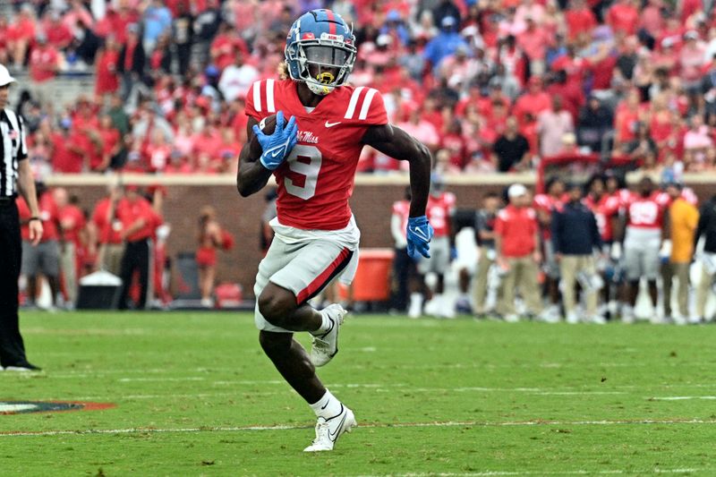 Sep 10, 2022; Oxford, Mississippi, USA; Ole Miss Rebels wide receiver Jaylon Robinson (9) runs the ball against the Central Arkansas Bears during the first quarter at Vaught-Hemingway Stadium. Mandatory Credit: Matt Bush-USA TODAY Sports