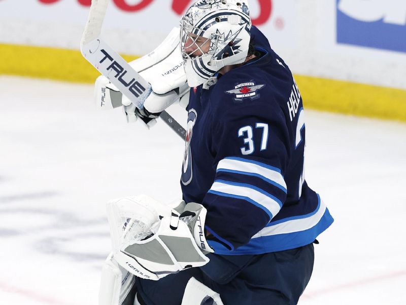 May 9, 2025; Winnipeg, Manitoba, CAN; Winnipeg Jets goaltender Connor Hellebuyck (37) celebrates the victory over the Dallas Stars in game two of the second round of the 2025 Stanley Cup Playoffs at Canada Life Centre. Mandatory Credit: James Carey Lauder-Imagn Images