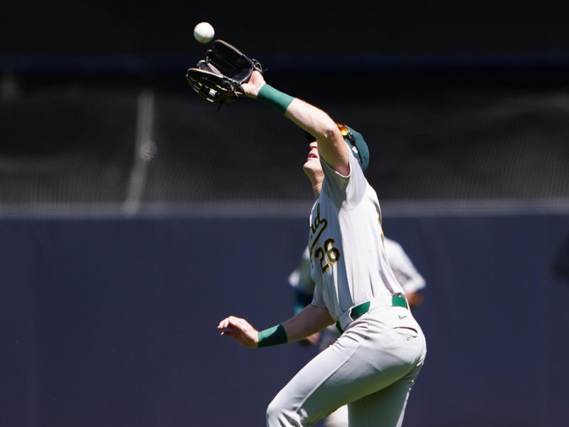 Apr 22, 2024; Bronx, New York, USA; Oakland Athletics left fielder Tyler Nevin (26) catches a fly ball hit by New York Yankees catcher Jose Trevino (not pictured) during the third inning at Yankee Stadium. Mandatory Credit: Gregory Fisher-USA TODAY Sports