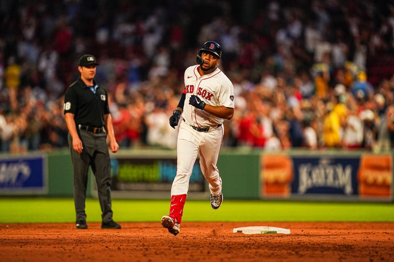 Jul 9, 2024; Boston, Massachusetts, USA; Boston Red Sox first baseman Dominic Smith (2) hits a home run against the Oakland Athletics in the second inning at Fenway Park. Mandatory Credit: David Butler II-USA TODAY Sports