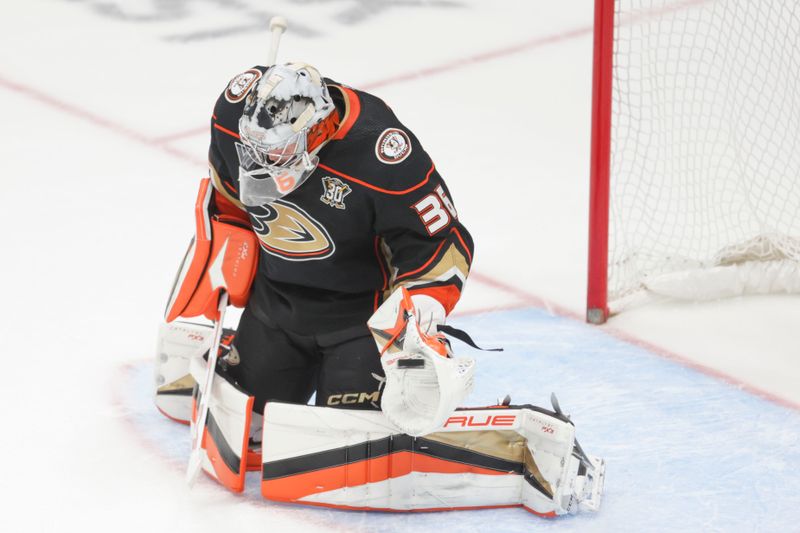 Dec 2, 2023; Anaheim, California, USA; Anaheim Ducks goalie John Gibson (36) catches the puck in a game against the Colorado Avalanche during overtime at Honda Center. Mandatory Credit: Yannick Peterhans-USA TODAY Sports