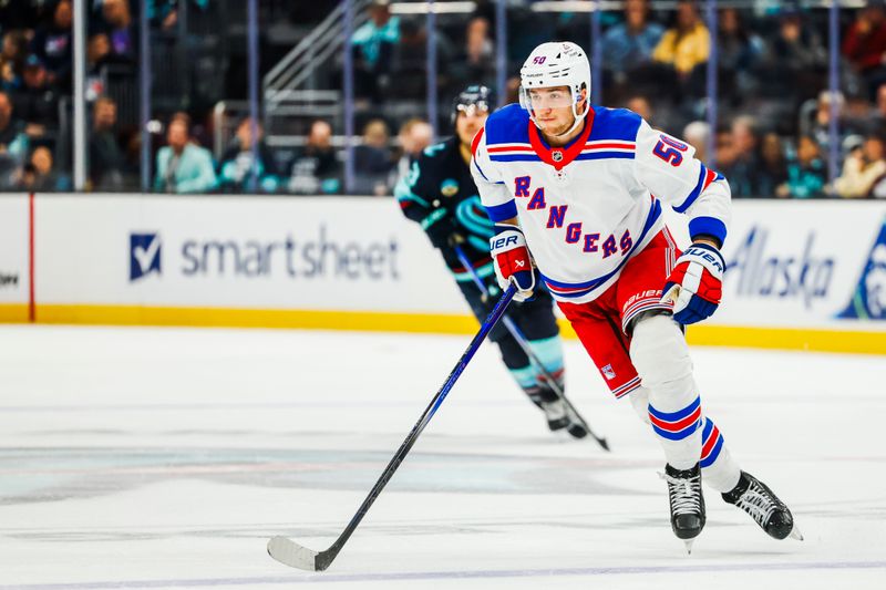 Nov 17, 2024; Seattle, Washington, USA; New York Rangers left wing Will Cuylle (50) follows the puck against the Seattle Kraken during the second period at Climate Pledge Arena. Mandatory Credit: Joe Nicholson-Imagn Images