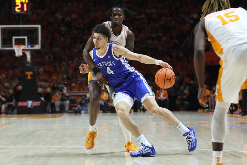 Jan 28, 2025; Knoxville, Tennessee, USA; Kentucky Wildcats guard Koby Brea (4) moves the ball against Tennessee Volunteers forward Felix Okpara (34) during the second half at Thompson-Boling Arena at Food City Center. Mandatory Credit: Randy Sartin-Imagn Images