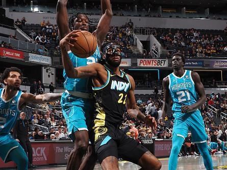 INDIANAPOLIS, IN - DECEMBER 20: Isaiah Jackson #22 of the Indiana Pacers grabs the rebound during the game against the Charlotte Hornets on December 20, 2023 at Gainbridge Fieldhouse in Indianapolis, Indiana. NOTE TO USER: User expressly acknowledges and agrees that, by downloading and or using this Photograph, user is consenting to the terms and conditions of the Getty Images License Agreement. Mandatory Copyright Notice: Copyright 2023 NBAE (Photo by Ron Hoskins/NBAE via Getty Images)