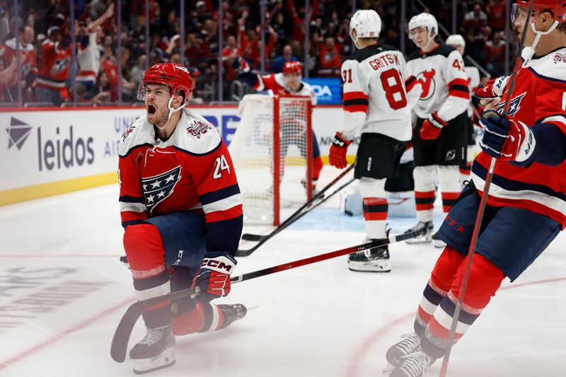 Nov 15, 2025; Washington, District of Columbia, USA; Washington Capitals center Connor McMichael (24) celebrates after scoring a goal against the New Jersey Devils during the third period at Capital One Arena. Mandatory Credit: Geoff Burke-Imagn Images