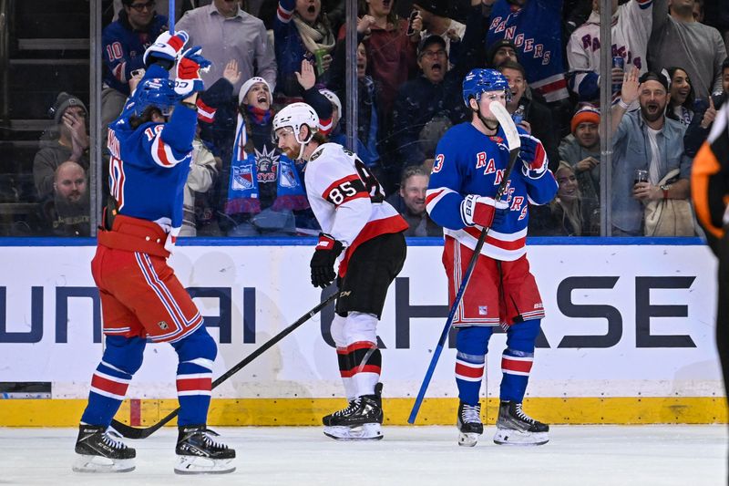 Jan 21, 2025; New York, New York, USA;  New York Rangers left wing Artemi Panarin (10) celebrates the goal by New York Rangers left wing Alexis Lafrenière (13)  against the Ottawa Senators during the first period at Madison Square Garden. Mandatory Credit: Dennis Schneidler-Imagn Images