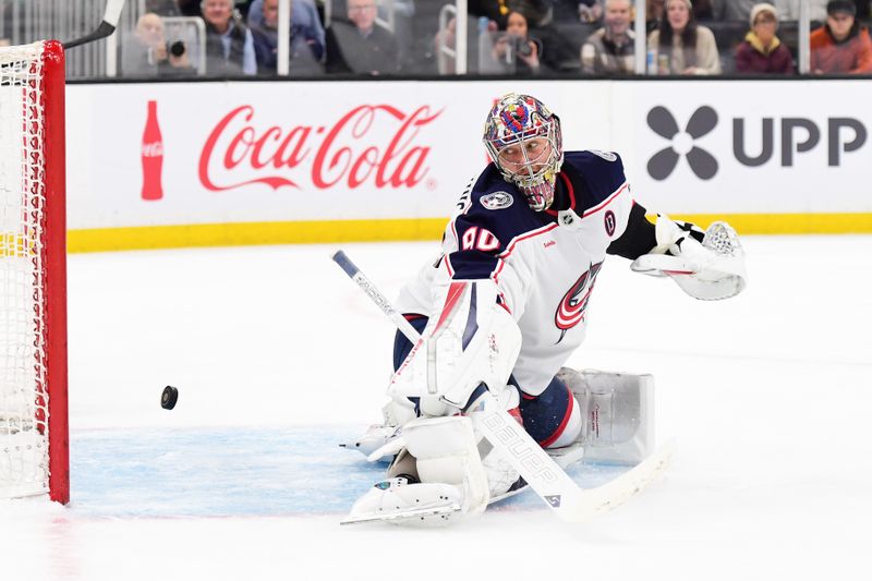 Nov 18, 2024; Boston, Massachusetts, USA;  Columbus Blue Jackets goaltender Elvis Merzlikins (90) makes a save during the first period against the Boston Bruins at TD Garden. Mandatory Credit: Bob DeChiara-Imagn Images