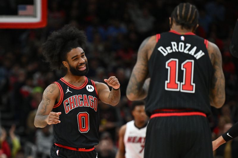 CHICAGO, ILLINOIS - NOVEMBER 18:  Coby White #0 of the Chicago Bulls celebrates after making a three-point basket in the first half against the Miami Heat on November 18, 2023 at United Center in Chicago, Illinois.   NOTE TO USER: User expressly acknowledges and agrees that, by downloading and or using this photograph, User is consenting to the terms and conditions of the Getty Images License Agreement.  (Photo by Jamie Sabau/Getty Images)