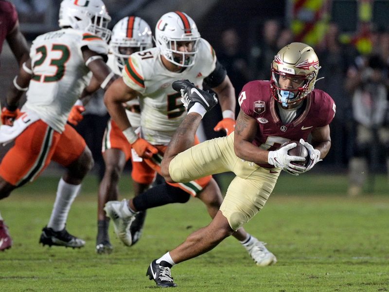 Nov 11, 2023; Tallahassee, Florida, USA; Florida State Seminoles wide receiver Ja'Khi Douglas (0) runs the ball against the Miami Hurricanes in the second half at Doak S. Campbell Stadium. Mandatory Credit: Melina Myers-USA TODAY Sports