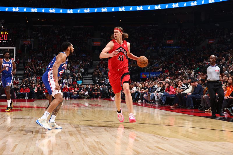 TORONTO, CANADA - MARCH 31: Kelly Olynyk #41 of the Toronto Raptor dribbles the ball during the game against the Philadelphia 76ers on March 31, 2024 at the Scotiabank Arena in Toronto, Ontario, Canada.  NOTE TO USER: User expressly acknowledges and agrees that, by downloading and or using this Photograph, user is consenting to the terms and conditions of the Getty Images License Agreement.  Mandatory Copyright Notice: Copyright 2024 NBAE (Photo by Vaughn Ridley/NBAE via Getty Images)